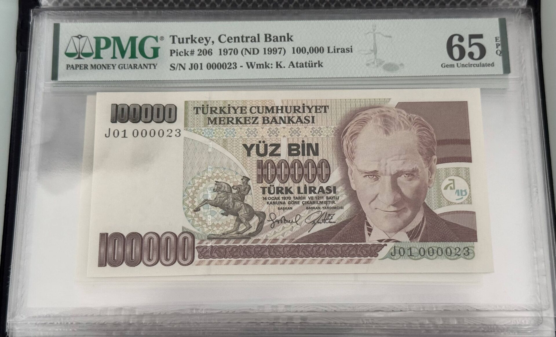 7. Ems 100.000 TL, J01 000023, PMG 65 Epq, ÇİL