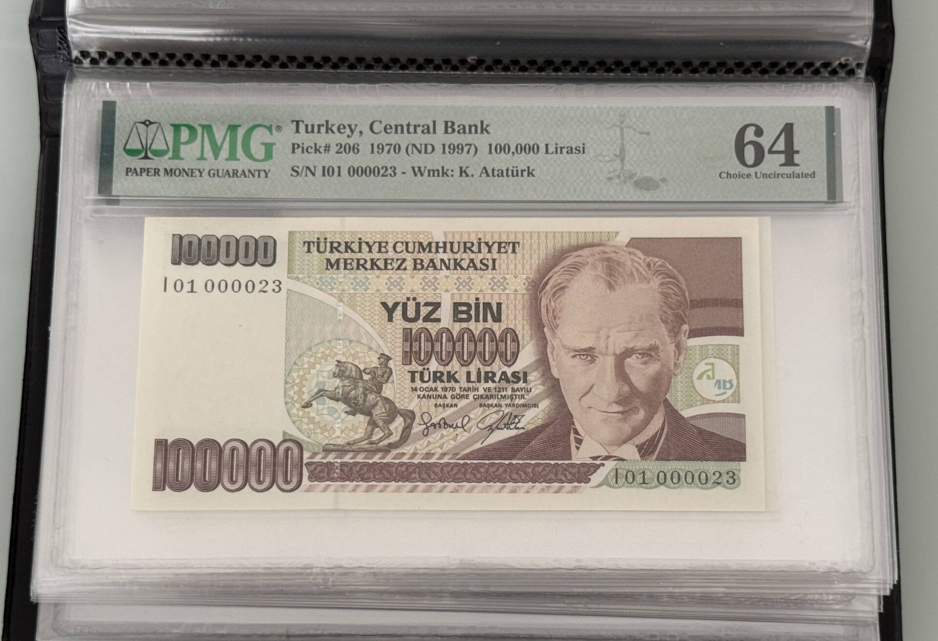 7. Ems 100.000 TL, I01 000023, PMG 64, ÇİL